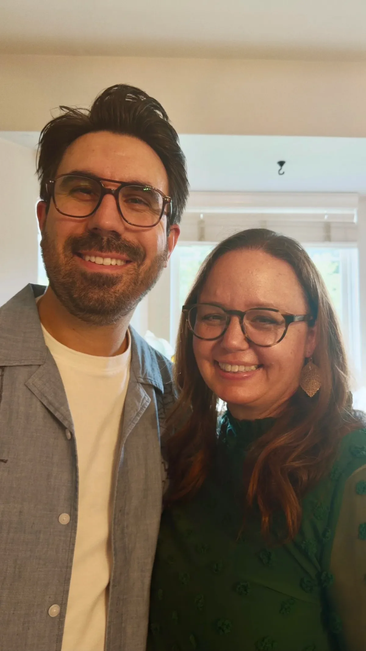 Jon and Julie Usborne, founders of Burrow Pictures, smiling together at home.